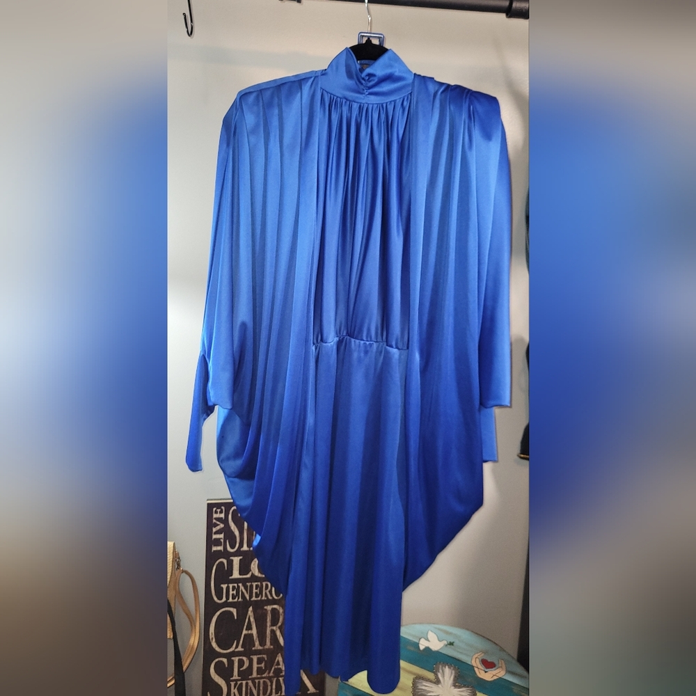 Elegant Blue Dress with High Neckline and Flowing Design